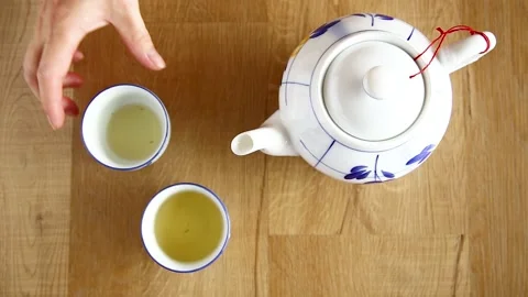 Man drinking cup of chinese tea Stock Footage 131380472
