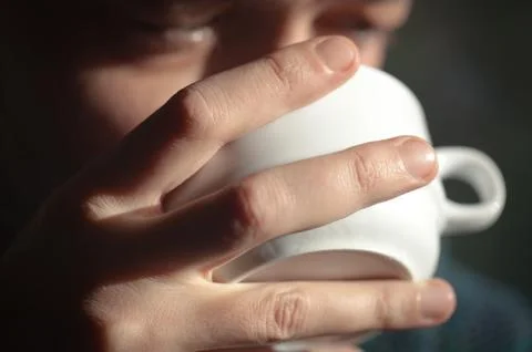 Man drinking a cup of coffee Stock Photos