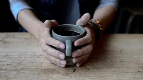 A man drinking a cup of hot black coffee (americano) Stock Footage 72782189
