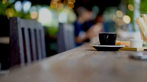 Man drinking espresso coffee in cafe with beautiful light bokeh background Stock Footage 93332539