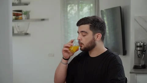 Man drinking fresh juice 스톡 동영상 241994251