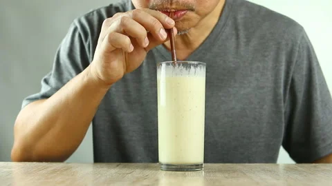 Man drinking  fruit  smoothie , in studio   Chiangmai  Thailand Stock Footage 152458789
