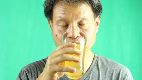 Man is drinking  ginger juice, in studio   Chiangmai  Thailand Stock Footage 195820040