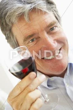 Man Drinking A Glass Of Red Wine Stock Photos