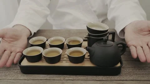 Man drinking green tea from Chinese tea set Stock Footage 323164313