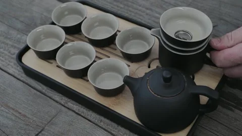 Man drinking green tea from Chinese tea set Stock Footage 323164397