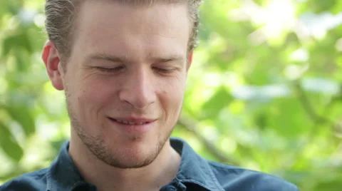 Man drinking from his cup of coffee, laughing Stock Footage 40663543