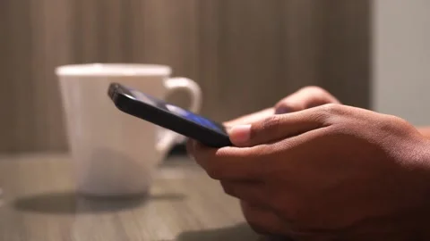Man drinking hot coffee from white mug sitting at the table Stock-Footage 337208492
