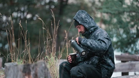 Man Drinking Mate Alone in Cold Weather Cinematic Reflective Outdoor Scene Stock Footage 334533234