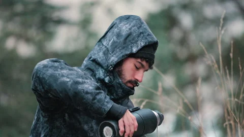 Man Drinking Mate in Winter Forest Setting Stock Footage 334632273