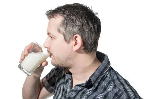 A man drinking milk in profile Stock Photos