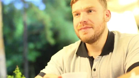 Man drinking morning coffee in the cafe Stock Footage