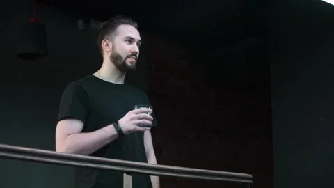 Man is drinking at the parapet Stock Footage 86251199