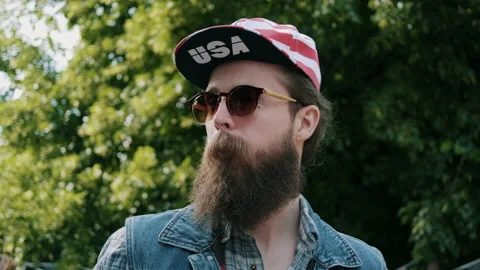 Man drinking from a plastic cup with USA hat on Video stock 133602850