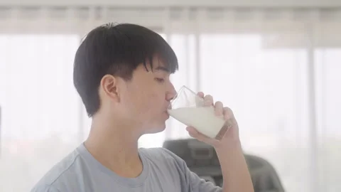 Man drinking protein shake after exercising at gym Video stock 248585508