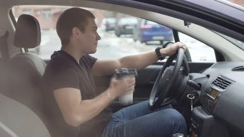 Man drinking protein shake in car. Stock Footage 73378491