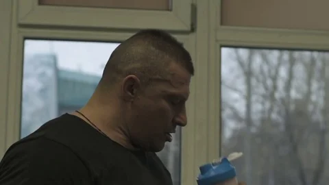 Man drinking protein shake at crossfit gym Stock Footage 70168156