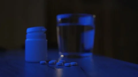 Man drinking sleeping pills late at night, close-up Stock-Footage 237181061