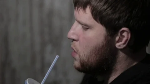 A Man Drinking Soda From A Straw Stock Footage 70468779
