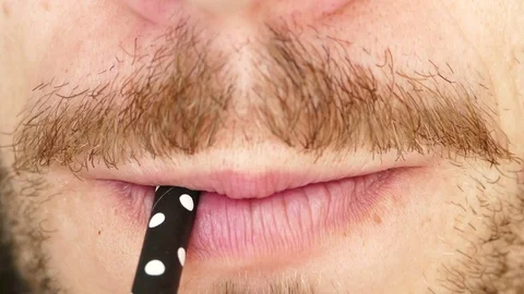 Man drinking with straw Stock Footage 78394990