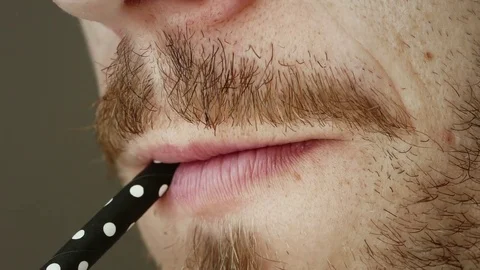 Man drinking with straw Stock Footage 78395165