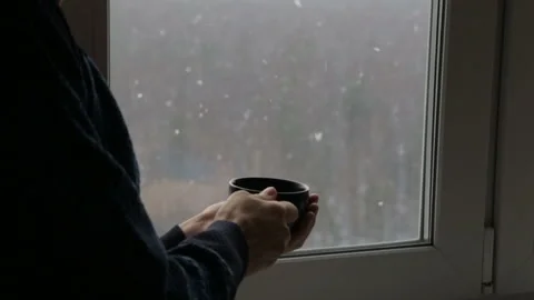 Man drinking tea near the window Stock Footage 126700398