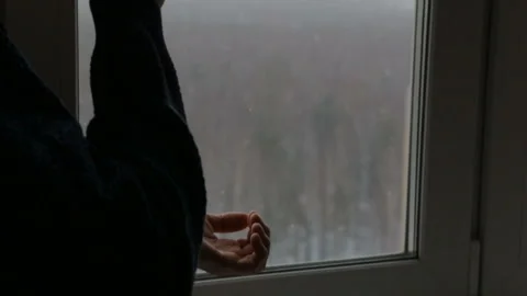 Man drinking tea near the window Video stock 126700450