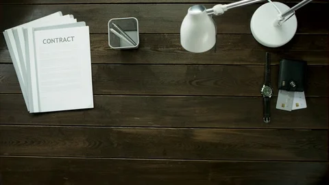 A man is drinking tea at the office table and speak with someone. Stock Footage 82181863