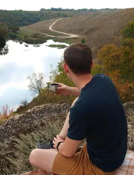 Man drinking tea outdoors Stock Photos