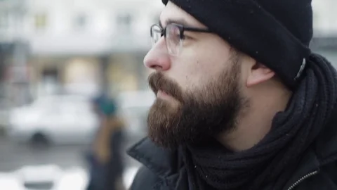 Man drinking tea from white cup on winter city street Stock Footage 71982777