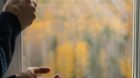 Man drinking tea at the window Stock Footage 102849445