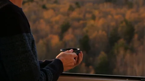 Man drinking tea at the window Stock Footage 102850277