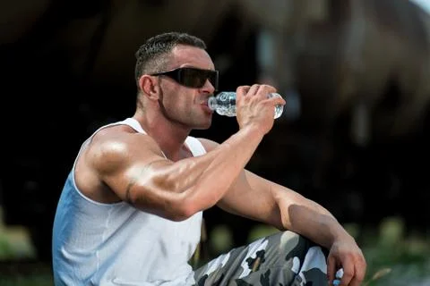Man drinking water after exercise Stock Photos