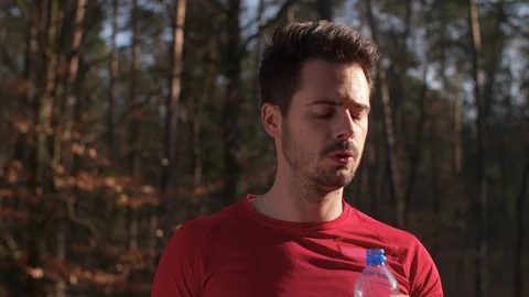 Man drinking water and resting after hard workout Stock Footage 102833206