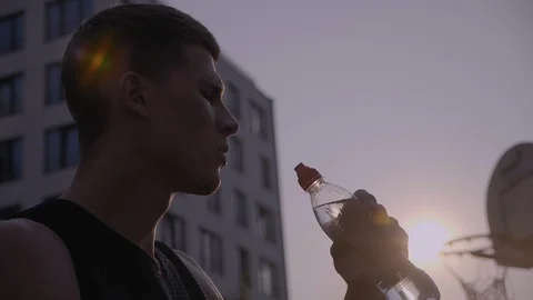 Man drinking water from the bottle after workout Stock Footage 97769798