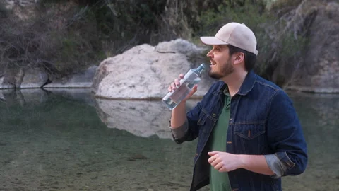 Man drinking water from a bottle Stock Footage 265106228
