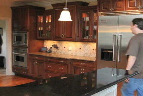 Man Drinking Water in Kitchen Stock-Footage 5186317