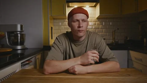 Man drinking water in the kitchen as part of a healthy lifestyle Stock Footage 316581036