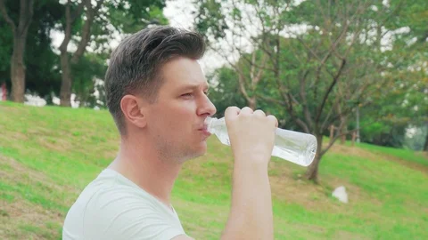 Man drinking water outside Stock Footage 100904995