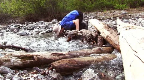 Man Drinking Water From River Stock Footage 61225814