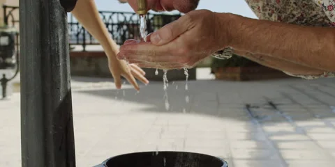 Man drinking water from tap Stock Footage 58857689