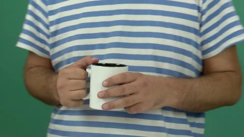 Man drinking a white cup of tea, Chroma key Video stock 344588973