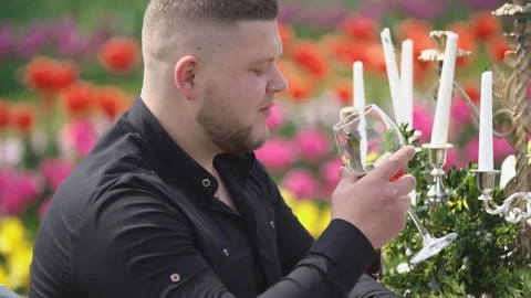 Man drinking wine sitting at the table Stock Footage 107641962
