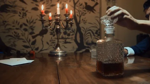 A man drinks alcohol at the table Stock Footage 87333264