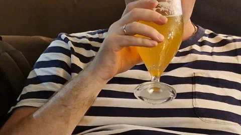 A man drinks beer in a cafe Stock Footage 247184039