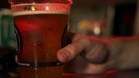 Man Drinks Beer From Plastic Cup 動画素材 83838115