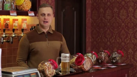 Man drinks beer in a pub Stock Footage 72930311