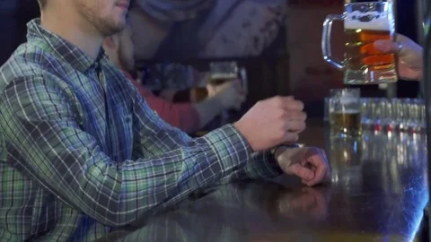 Man drinks beer at the pub Video stock 73716900