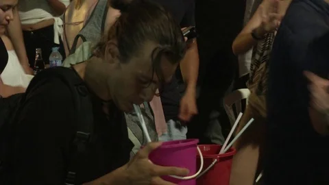 Man Drinks Buckets on Khao San Rd Stock-Footage 69932798
