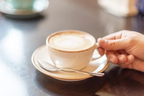 A man drinks coffee for breakfast Stock Photos